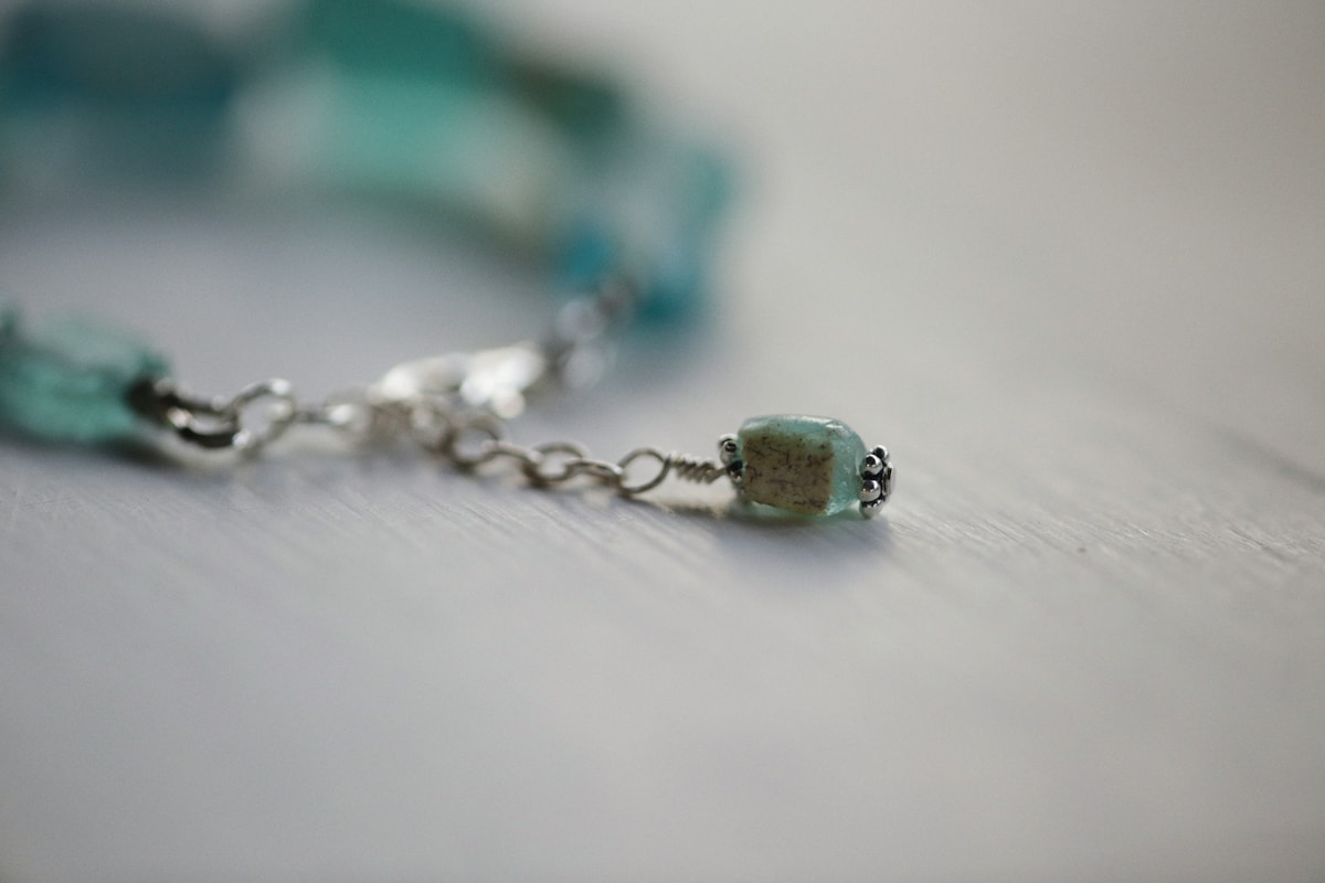 a close up of a bracelet on a table