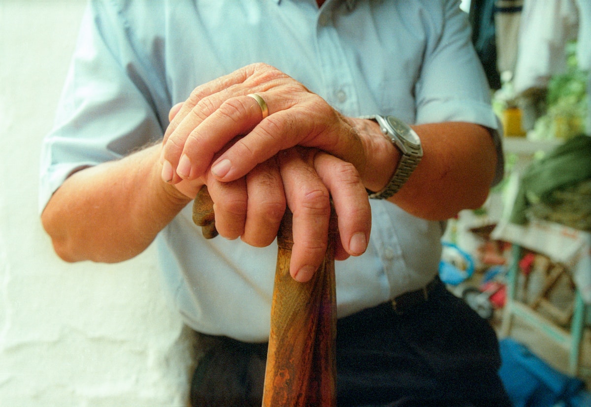 a man holding a wooden stick in his hands