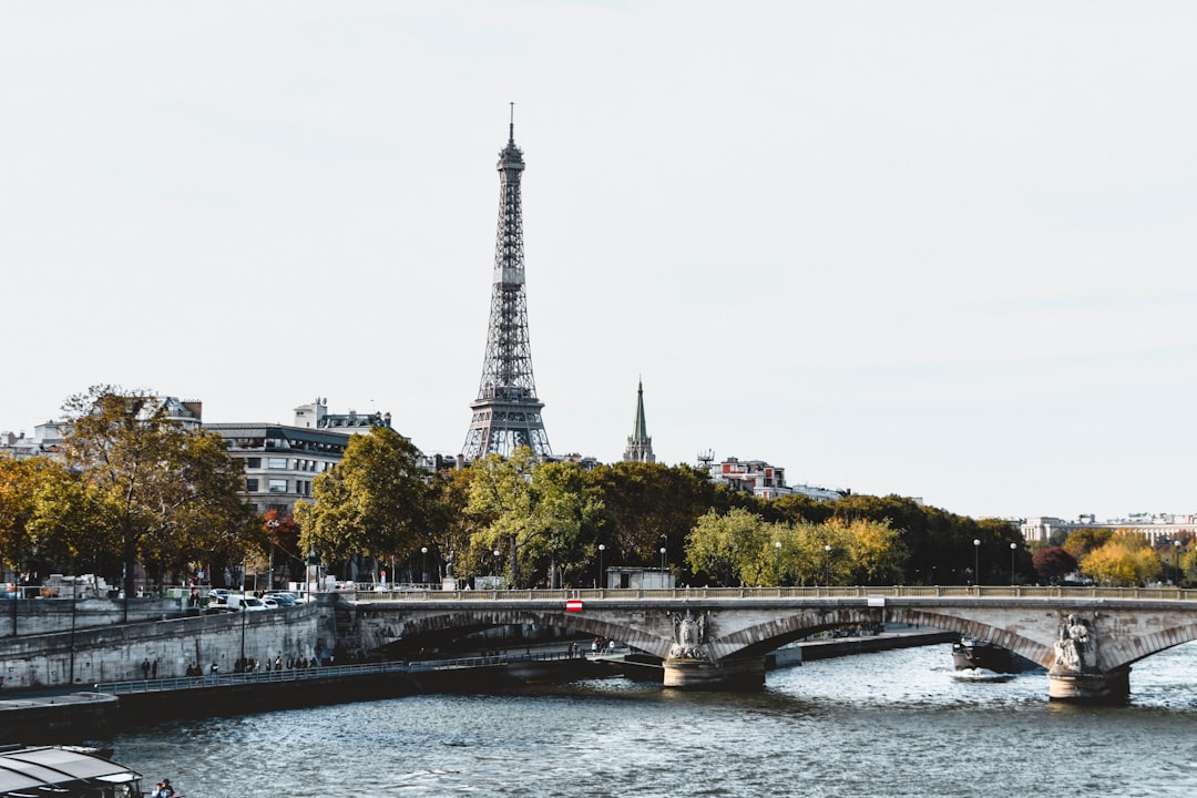 piercing paris - eiffel tower near body of water during daytime